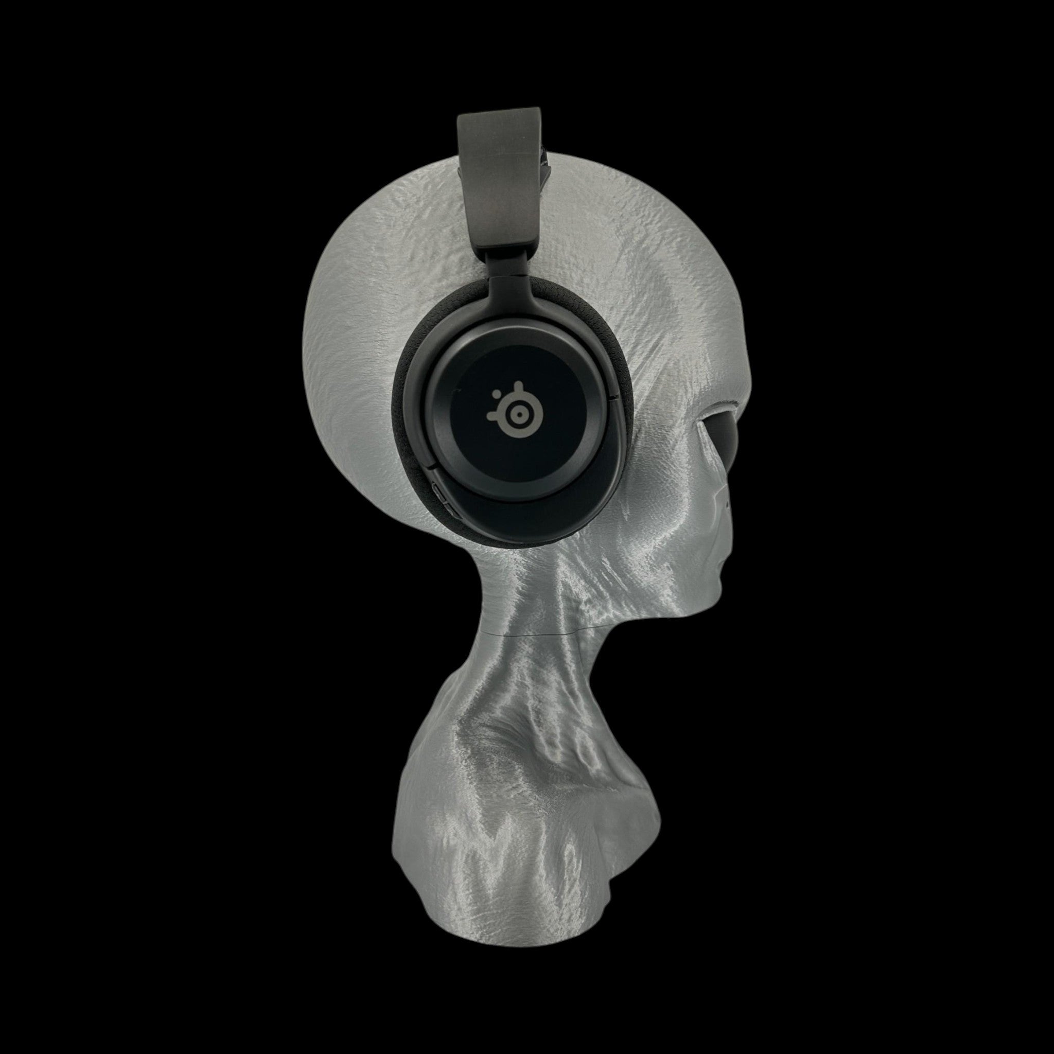 Grey Alien Headphone Stand – 12" — on display stand, 3D printed replica on black background