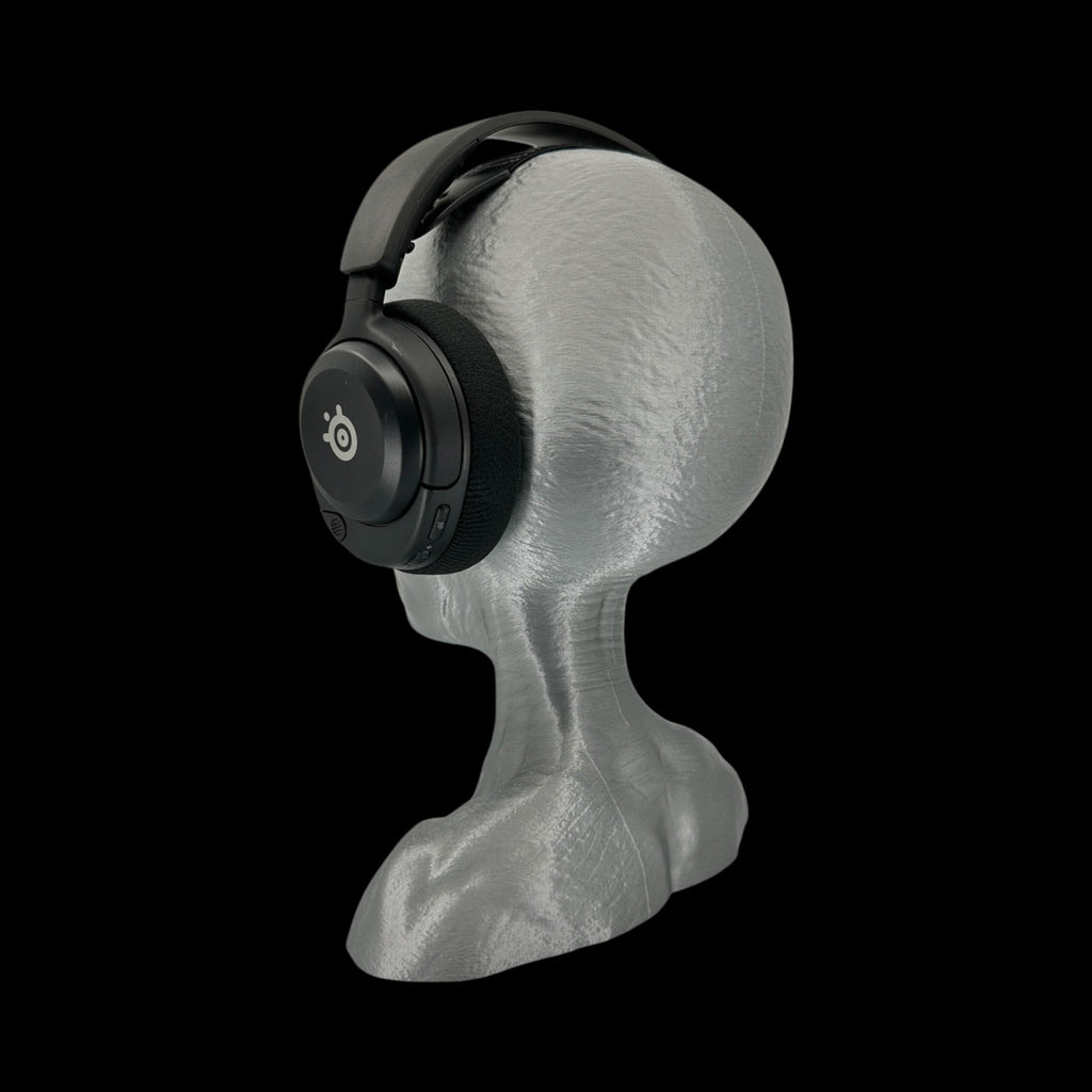 Grey Alien Headphone Stand – 12" — on display stand, 3D printed replica on black background