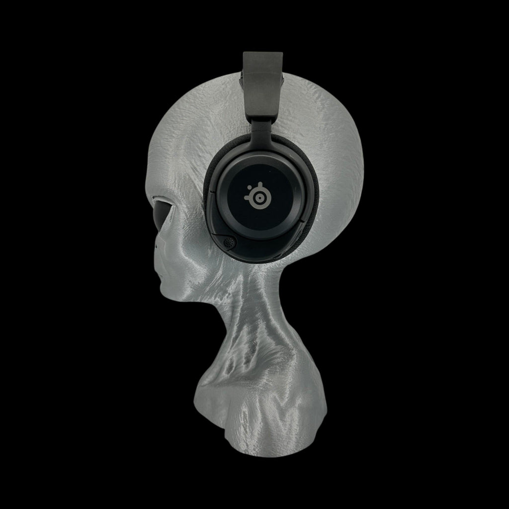 Grey Alien Headphone Stand – 12" — on display stand, 3D printed replica on black background